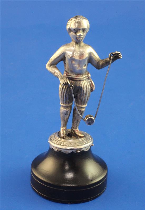 A continental silver miniature figure of a negro playing diablo, overall 4.75in.